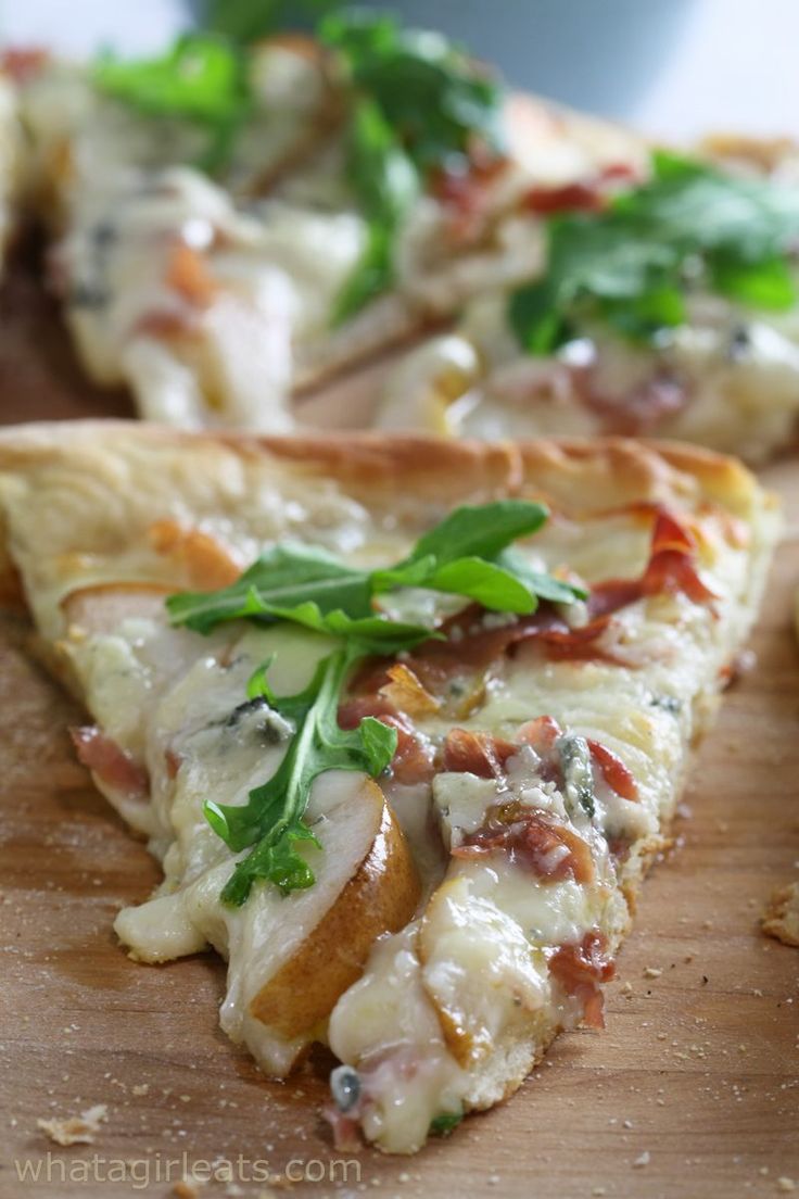 a slice of pizza on a wooden cutting board