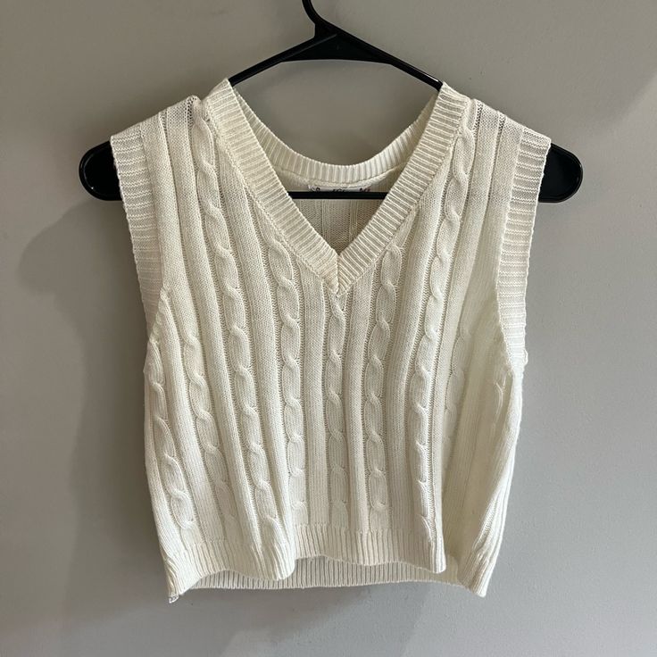 Cream Knit Vest Size: Medium / Brand: Fct With Love Never Worn Great Condition And Super Soft Fits Like A S/M White Textured Knit V-neck Sweater Vest, White Cotton V-neck Knit Top, Trendy White V-neck Knit Top, Casual White Open Knit Sweater Vest, White Knit Sweater Vest For Spring, Chic White Knit Sweater Vest, White Knitted V-neck Sweater Vest, Chic White Textured Knit Sweater Vest, White Open Knit Sweater Vest