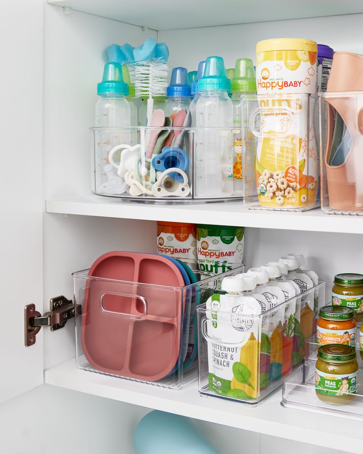 the shelves are filled with baby bottles and containers