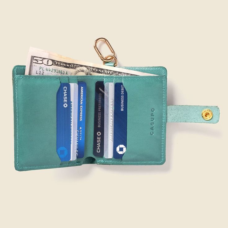 an open wallet with two credit cards in it