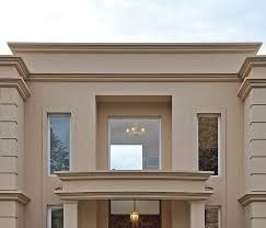 the front entrance to a two story house with large windows and doors on both sides