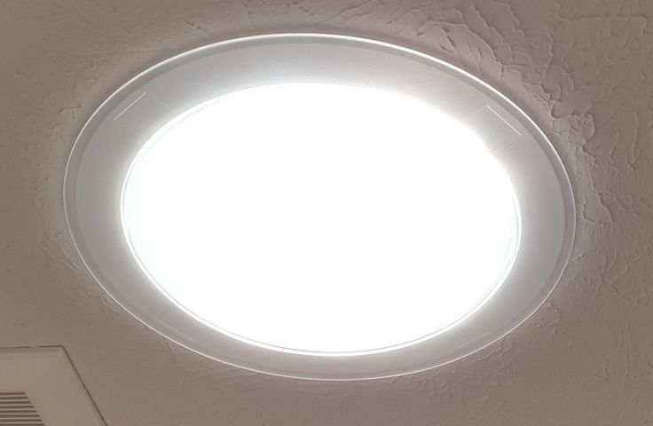 a round light fixture mounted on the ceiling