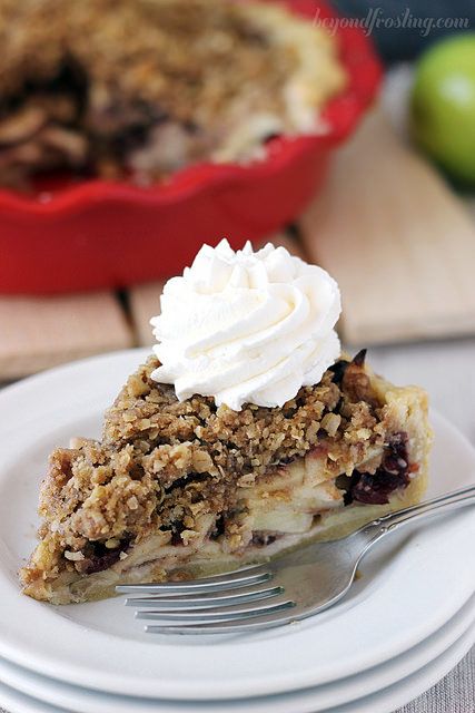 a slice of cranberry apple pie on a plate