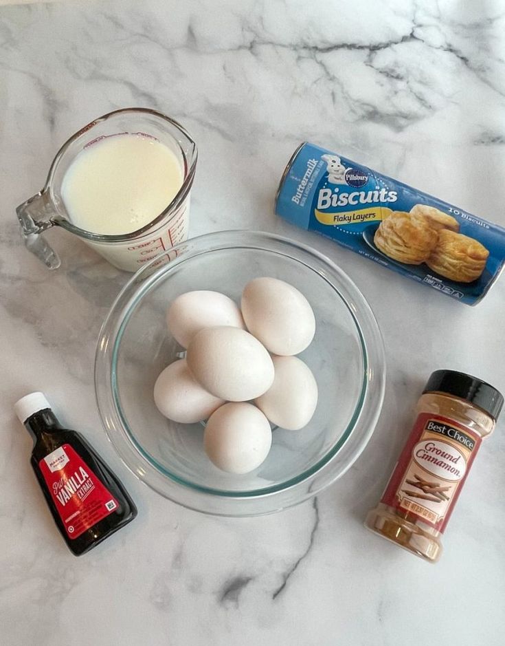 eggs, milk, and other ingredients on a marble counter top