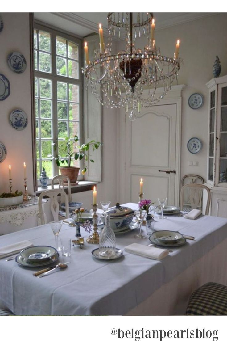 a dining room table is set with plates and silverware