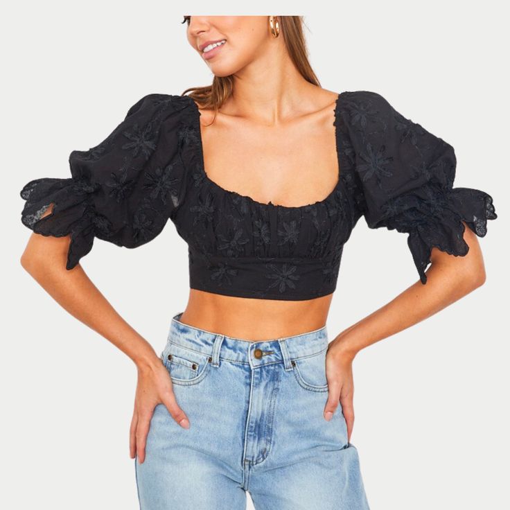 Dive into summer with the Jade Crop Top, where comfort meets refined style. This exquisite piece showcases delicate embroidery that elevates your casual wardrobe with a touch of sophistication. Designed with puff sleeves for a playful, voluminous look and a ruched front detail to flatter your silhouette, it's the epitome of elegance and fun. Billowy Feminine Summer Tops, Summer Tops With Gathered Balloon Sleeves, Trendy Summer Puff Sleeve Top With Balloon Sleeves, Summer Balloon Sleeve Top With Gathered Sleeves, Summer Cotton Puff Sleeve Top With Gathered Sleeves, Black Balloon Sleeve Summer Blouse, Black Balloon Sleeve Blouse For Summer, Summer Puff Sleeve Top With Balloon Sleeves, Summer Lantern Sleeve Puff Top For Daywear