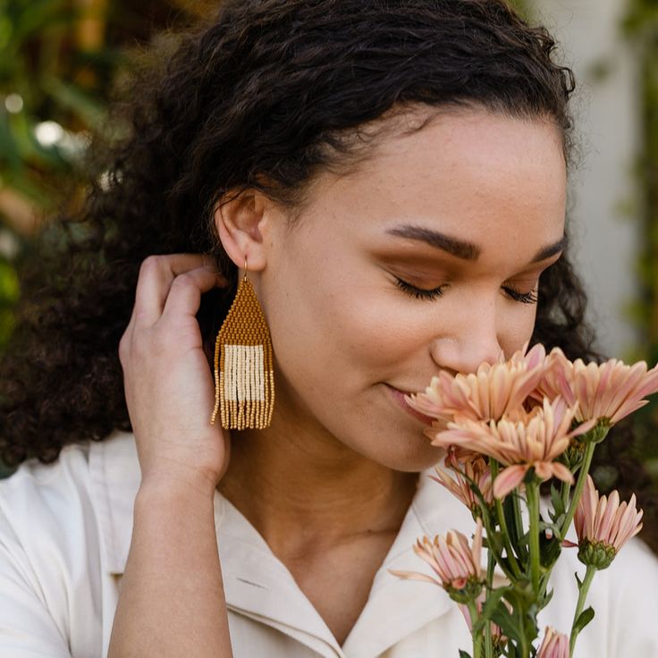 YEWO's Pawalo Bead Earrings offer beautiful and unique design with a guaranteed ethical origin. Crafted by Malawian artisans trained in an eco-friendly solar-powered workshop, each earring is intricately handwoven with Japanese glass beads. Choose a special piece that not only complements any outfit but also stands for ethical craftsmanship and conscious production. 3.5" Gold-filled hoops with Japanese Glass Beads Simply buff with the pad until the patina is lifted and the piece shines Artisan Handwoven Beaded Dangle Earrings, Elegant Handwoven Natural Jewelry, Elegant Handwoven Jewelry, Artisan Woven Dangle Earrings, Woven Beaded Drop Earrings As Gift, Gift Woven Beaded Drop Earrings, Elegant Handwoven Beaded Earrings As Gift, Elegant Handwoven Beaded Earrings For Gift, Artisan Handwoven Teardrop Earrings