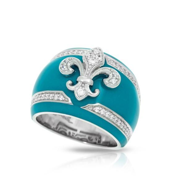 Fleur de Lis embodies the pure elegance and luxury of archetypal European flair. Illustrating a contemporary look at a classical design, this gorgeous set merges clean lines with rich sumptuous color. Made of sterling silver, hand-painted Italian enamel and pave-set stones, Fleur de Lis will perfectly complement any ensemble. Blue: Hand-painted blue Italian enamel and white pave-set stones set into rhodium-plated, nickel allergy-free, 925 sterling silver. Teal: Teal hand-painted Italian enamel w Elegant Wide Band Jewelry With Ring Detail, Elegant Wide Band Promise Ring, Elegant Sterling Silver Wide Band Ring For Promise, Elegant Wide Band Ring For Formal Occasions, Elegant White Gold Dome Ring With Open Band, Elegant Formal Enamel Ring With Polished Finish, Elegant Enamel Ring With Polished Finish For Formal Occasions, Elegant Wide Band Ring, Elegant Open Band Dome Ring For Formal Occasions