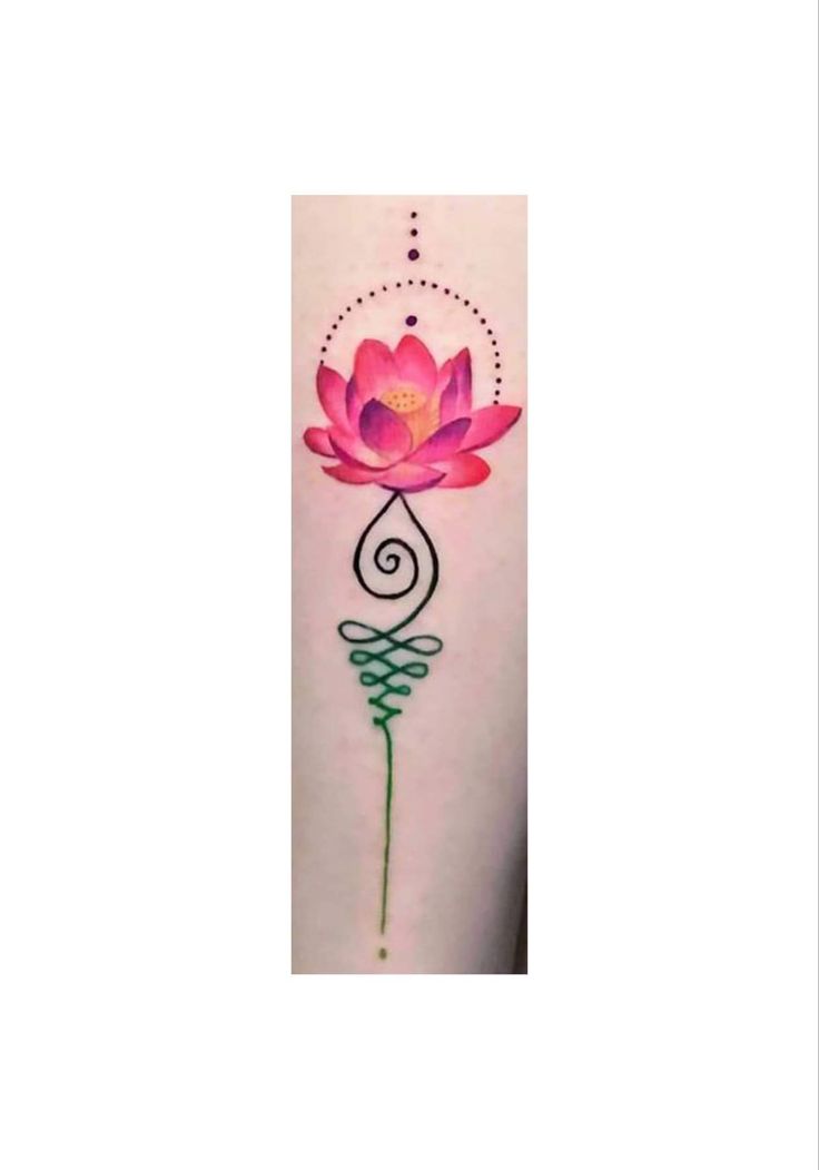 a tattoo with a pink flower on it