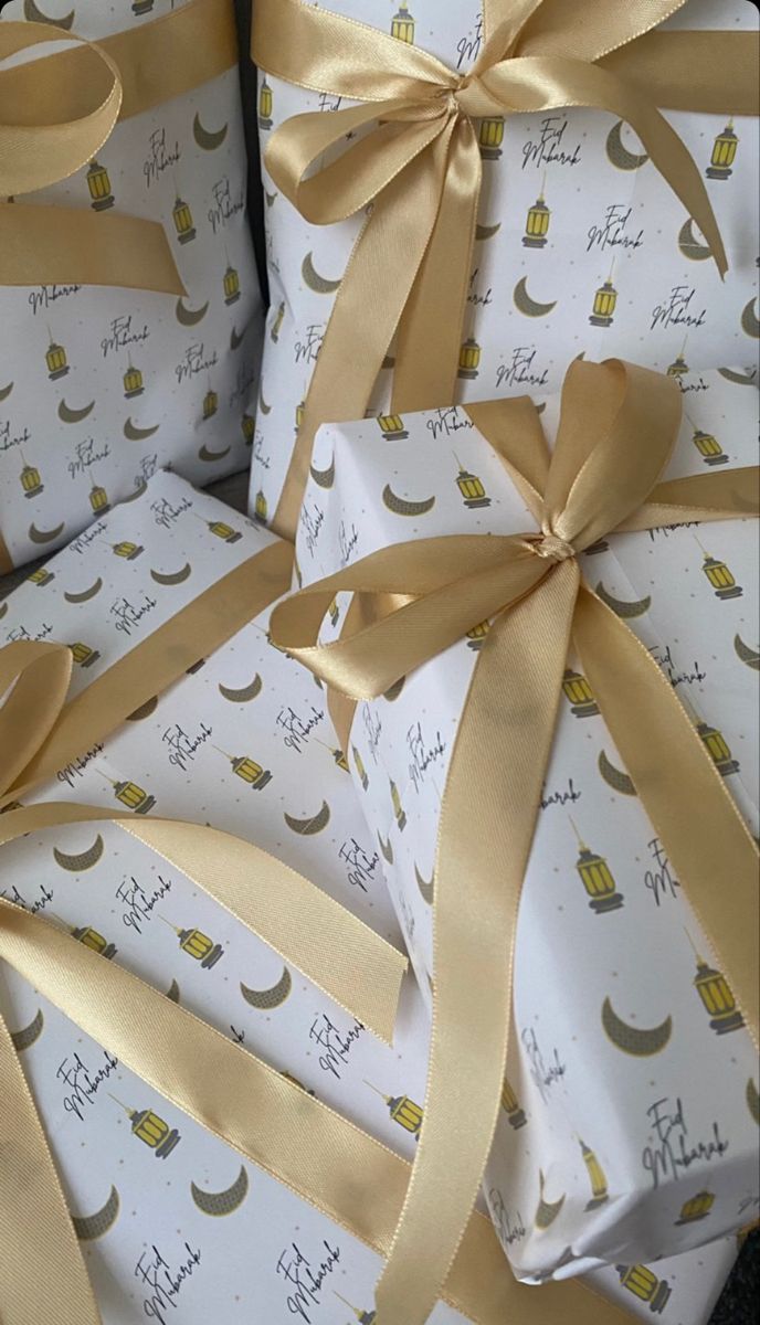 wrapped presents with golden ribbons and bows