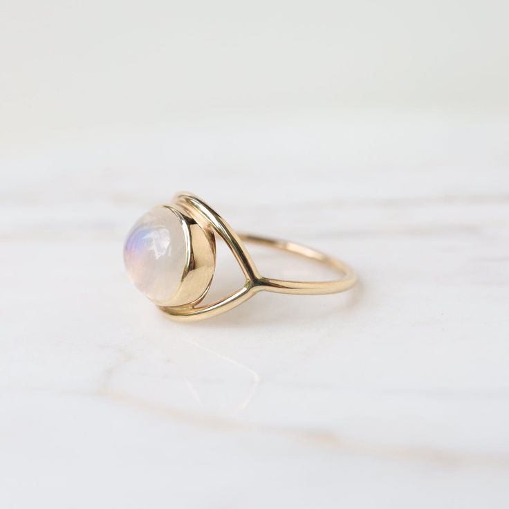 Moonstone cabochon 14k yellow gold 1.3mm band thickness Handmade by Halcyon Jewelry in Maine Timeless jewelry made by hand. Inspired by the ancients, imbued with magic, and made with love & sustainability in mind. Made with recycled metals and responsibly sourced stones. Timeless Jewelry, Recycled Metal, Moonstone Ring, Made With Love, Moonstone, With Love, Sustainability, Jewelry Making, Yellow Gold