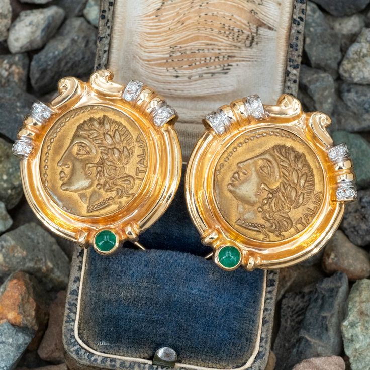 These Robert Bartholomew designed earrings are each centered with an Italian gold toned base metal token. The token depicts on the obverse with a Roman woman in profile wearing a leaf headdress, earrings and a beaded necklace . The reverse of the token depicts a soldier scene. The frame of the earrings are each accented with one (1), bezel set, round cabochon cut natural emerald and twelve (12), bead set, round brilliant cut diamonds. The earrings measure 31mm wide and is finished with omega sty Woman In Profile, Medallion Earrings, A Soldier, Bead Set, Matching Necklaces, Natural Emerald, Round Brilliant Cut Diamond, Modern Jewelry, Base Metal