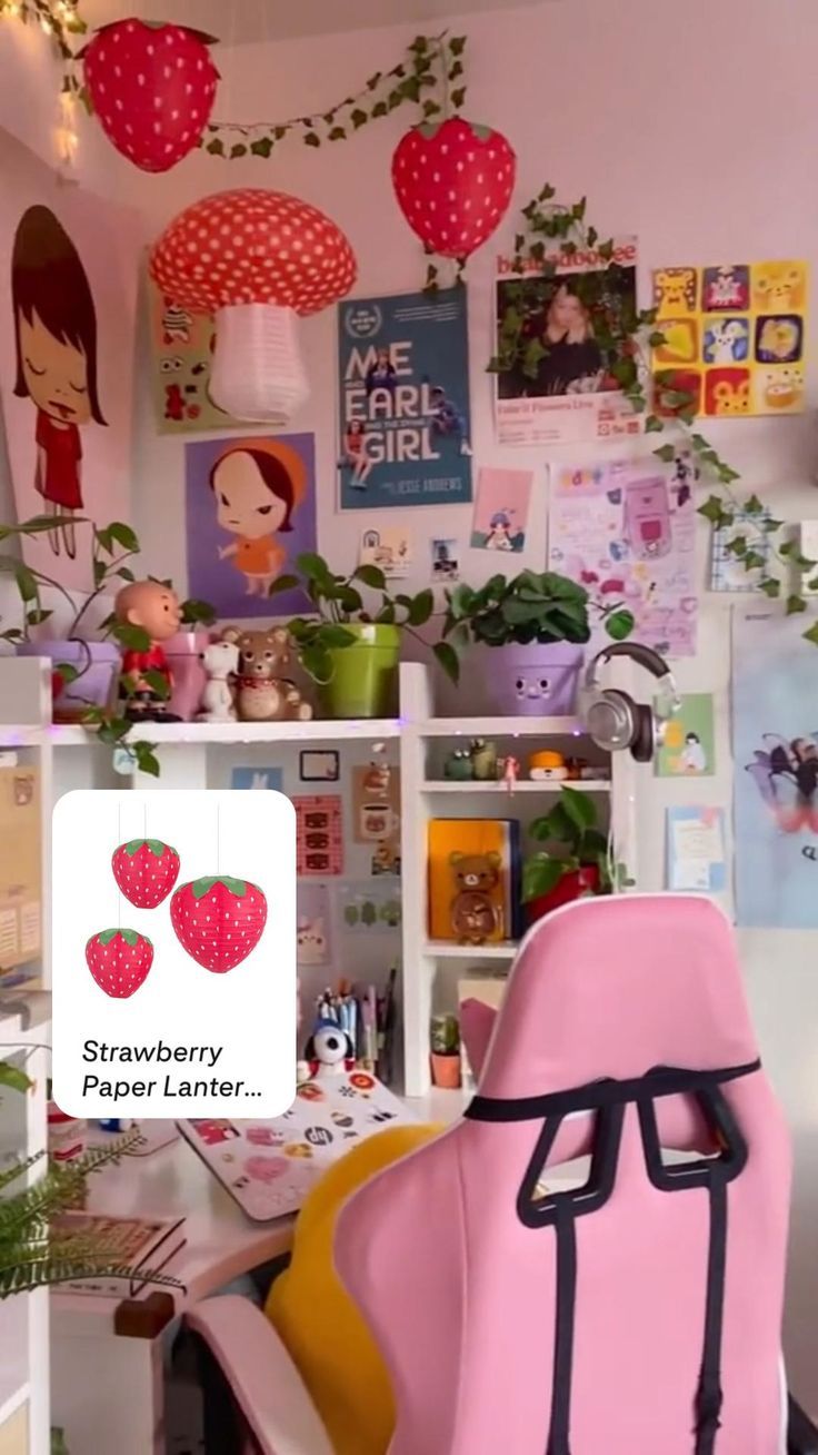 a pink chair sitting in front of a desk