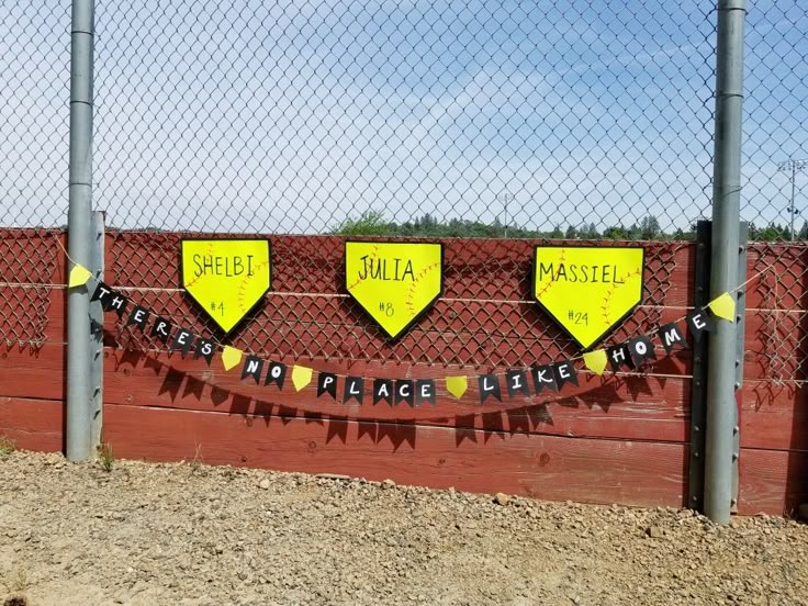 there is a fence that has some signs on it