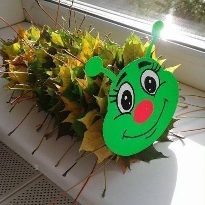 a green plant sitting on top of a window sill