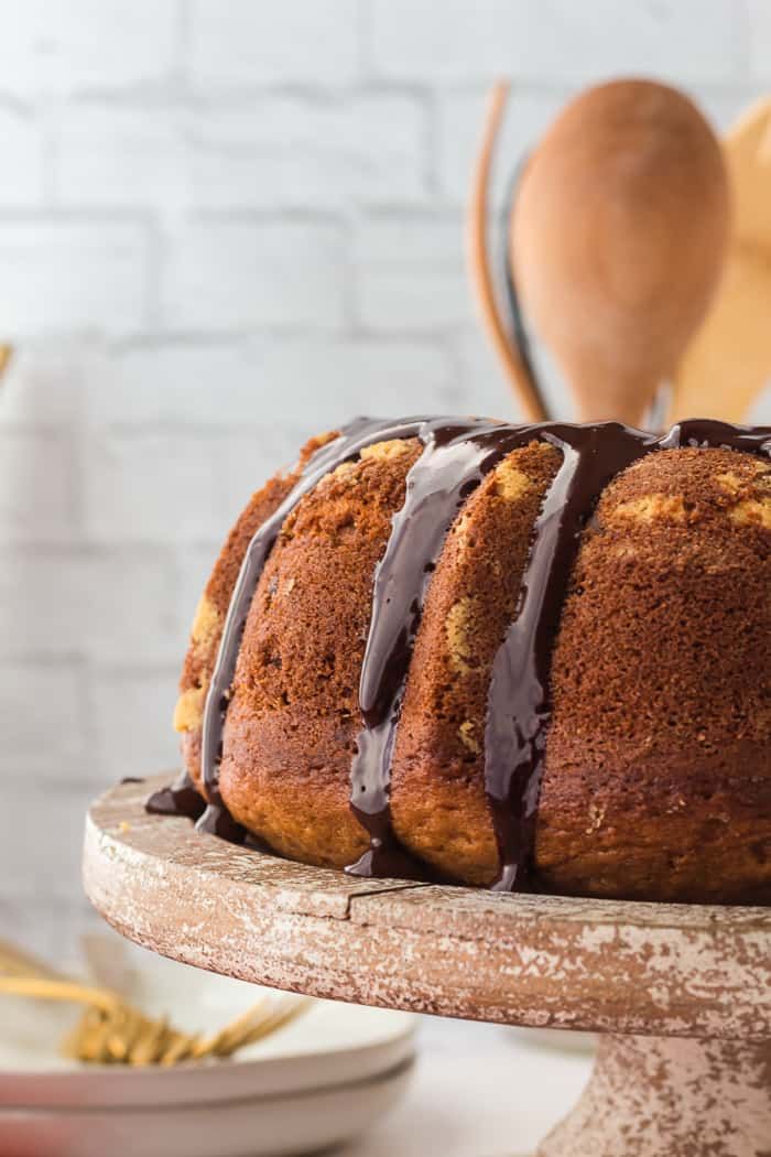 a bundt cake with chocolate drizzled on top