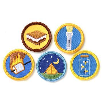 four patches with different types of camping related items in the middle one has a toothbrush, an umbrella, and another has a lighter on it