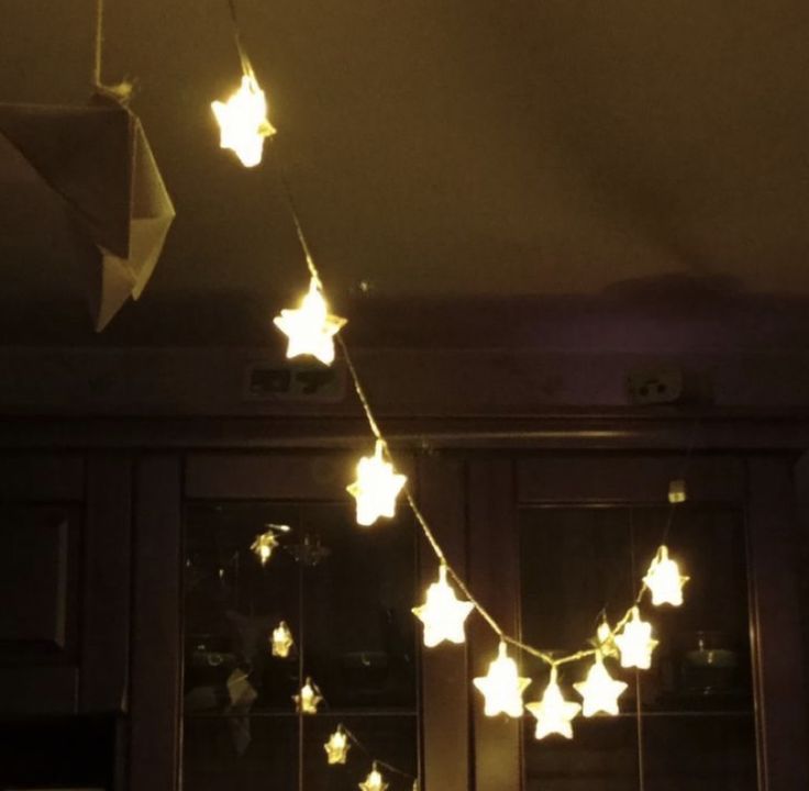 a string of star lights hanging from the ceiling