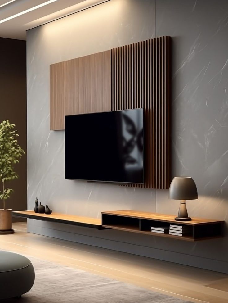 a living room with a large flat screen tv mounted on the wall next to a potted plant