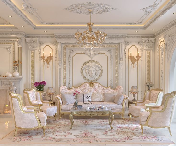 a fancy living room with white furniture and chandelier