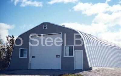 a large metal building sitting on the side of a road