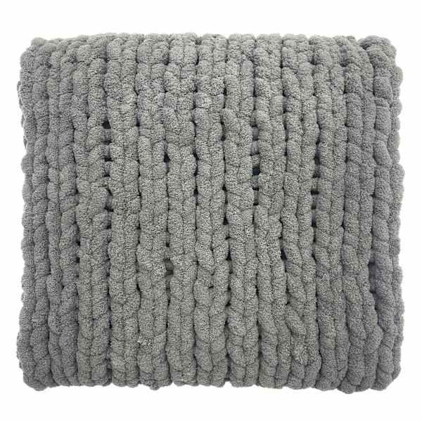 a gray pillow with grey yarn on it