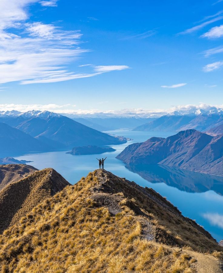 Young Asian couple celebrating at Roy's Peak Lake Wanaka, New Zealand Roy’s Peak New Zealand, Nature New Zealand, Queenstown New Zealand Aesthetic, Hanmer Springs, New Zealand Nature, Wanaka New Zealand, New Zealand Flag, New Zealand Itinerary, Asian Couple