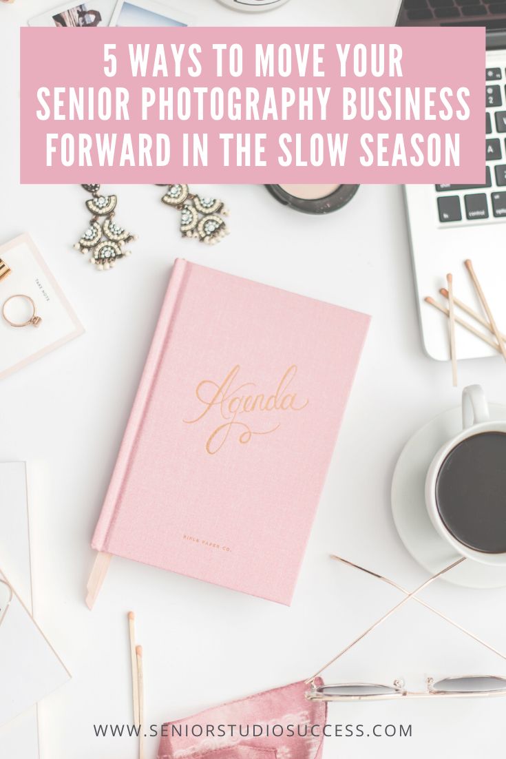 a pink book sitting on top of a desk next to a laptop and coffee cup