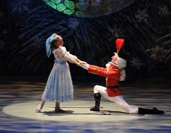 two people in costume performing on stage