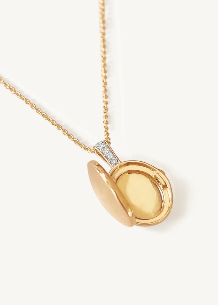 Home is where the heart is. Our Maison Gold Lockets are heirlooms that represent a moment in time. Keep this locket as a family heirloom forever. Wear her blank or get her engraved with your signature letter. To engrave more than one letter, visit HERE.Already have a chain? To purchase the locket individually, visit HERE. Photo dimensions: 14mm x 11.5mmTo add a photo inside, simply open the locket and carefully press the photo into place. Our lockets do not have a separate opening for a photo. F Luxury Yellow Gold Oval Locket Necklace, Oval Diamond Necklace With Polished Finish For Gifts, Luxury Memorial Locket Jewelry, Luxury Oval Pendant Locket Necklace As Gift, Oval Diamond Locket Necklace, Luxury Oval Locket Jewelry, Luxury Locket Necklace, Luxury Oval Locket Necklace As Gift, White Gold Oval Link Locket Necklace