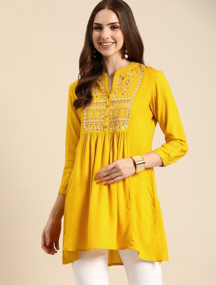 * Floral Embroidered Mirror Work Pleated Kurti Embroidered Kurti / Printed Short Kurti / Indian Tunic / Summer-Spring Evening Dress Boho Tunic / Hippie Dress / Tribal Print Top * Mustard yellow a-line kurti * Floral embroidered * Mandarin collar, three-quarter, regular sleeves * Mirror work *Fabric:- Viscose Rayon *Wash Care:- Machine Wash AVAILABLE IN 6 SIZES THEY ARE IN FOLLOWING MEASUREMENTS IN INCHES:- XS:- Bust-34/Waist-26/Length-32 S:- Bust-36/Waist-28/Length-32 M:- Bust-38/Waist-30/Length-32 L:- Bust-40/Waist-32/Length-32 XL:- Bust-42/Waist-34/Length-32 XXL:- Bust-44/Waist-36/Length-32 NOTE ►►CUSTOMISATION We do customisation ️ ►►TRACKING We give full tracking to our valuable customers, you can track your package any time with tracking code provided by our shop. ►► Please feel free Tunics For Women Indian, Pleated Kurti, Floral Kurti, Yellow Kurti, Kurti Top, Ethnic Kurti, Kurta Top, A Line Kurti, Kurtis For Women