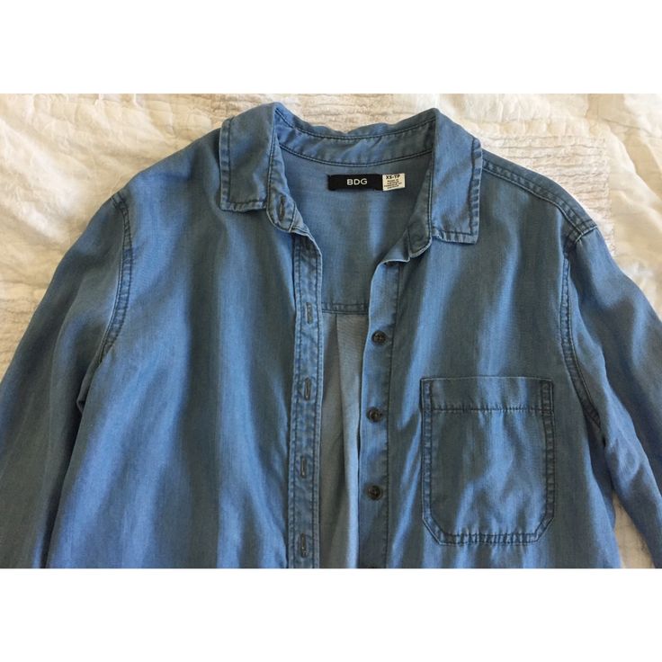 Button Up From Urban Outfitters!! Fits Oversized, Looks Like Denim But Is A Very Soft Material Labeled As 100% Tencel. Never Worn:) Bundle 3 For 15% Off Medium Wash Button-up Denim Top With Buttoned Pockets, Blue Chambray Button-up Denim Jacket, Washed Blue Button-up Denim Top For Day Out, Cotton Denim Button-up Top, Washed Blue Button-up Denim Jacket For Day Out, Medium Wash Button-up Denim Jacket For Day Out, Washed Blue Cotton Button-up Denim Top, Everyday Denim Button-up Jacket, Light Wash Chambray Denim Jacket With Button Closure