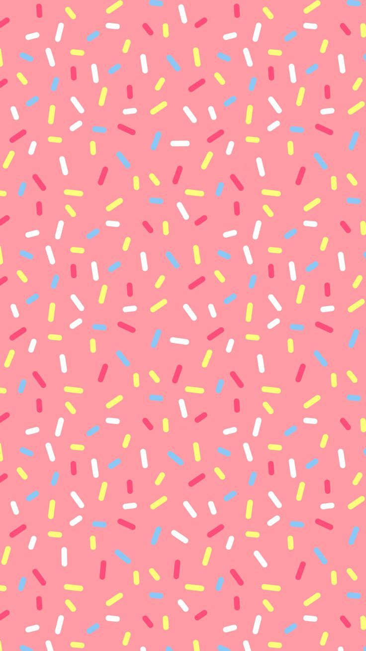 a pink background with colorful sprinkles on it