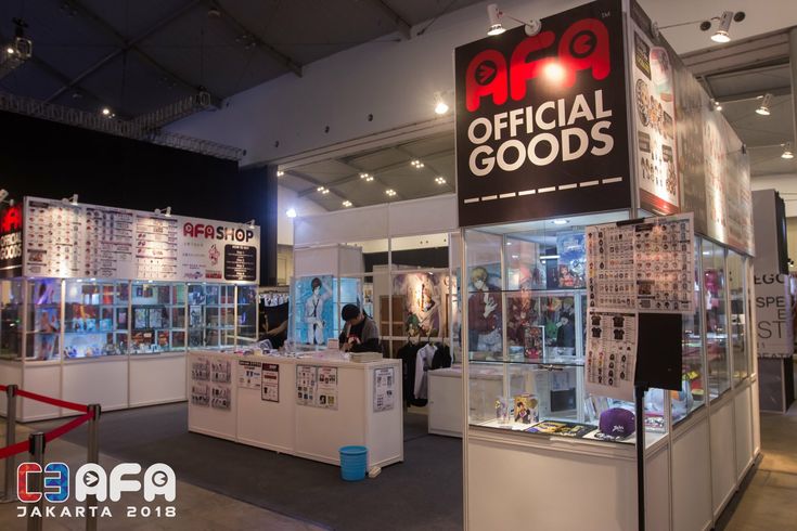 the inside of a retail store with many items on display and people looking at them