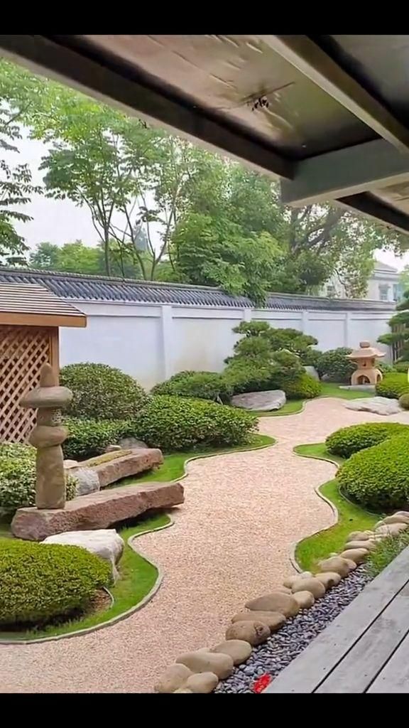 an outdoor garden with rocks and grass