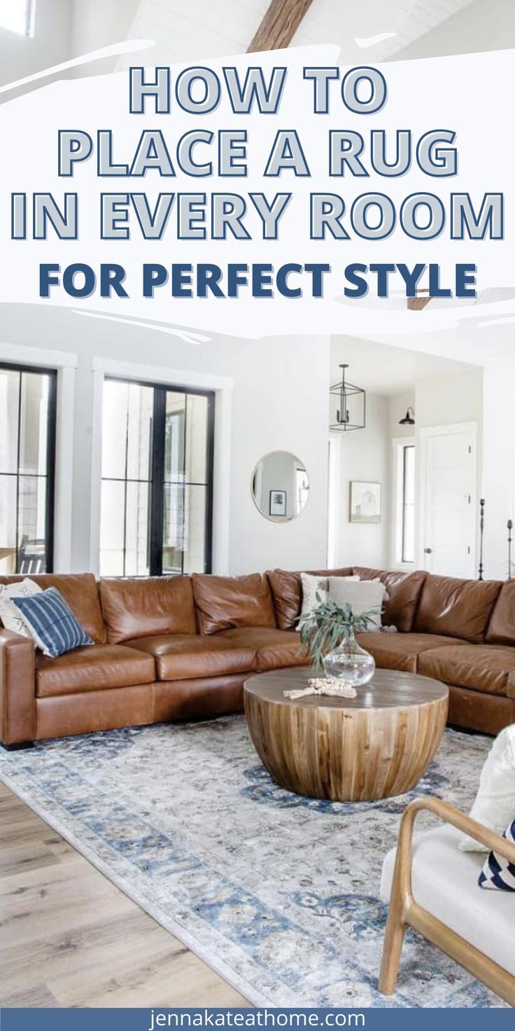 a living room filled with furniture and a large rug on top of a wooden floor