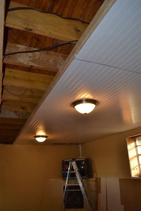 an unfinished room with a ladder up to the ceiling