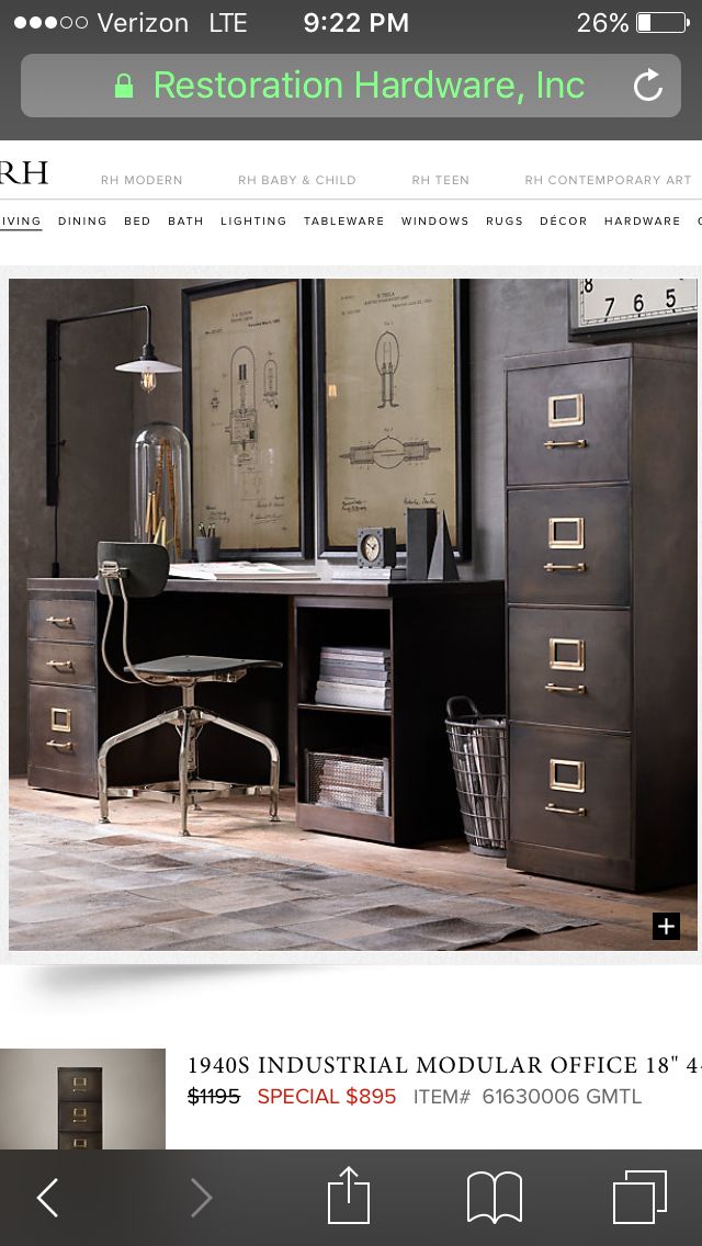 a desk with drawers and a clock on the wall next to it in a room