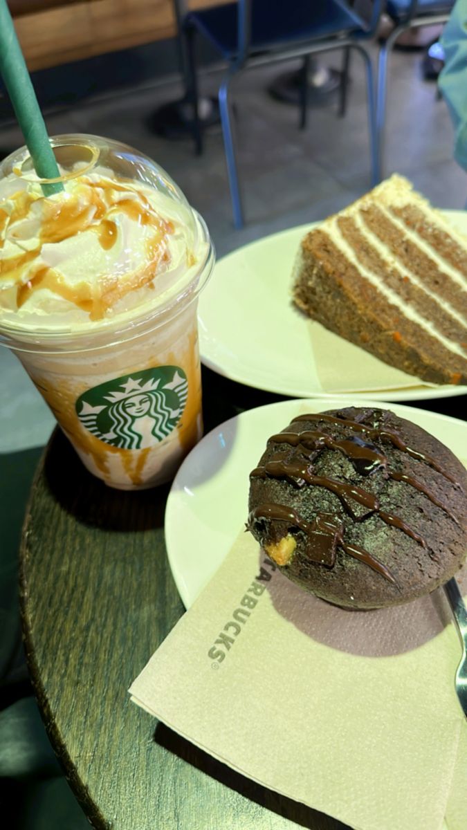 two plates with desserts on them and a cup of starbucks coffee in the background