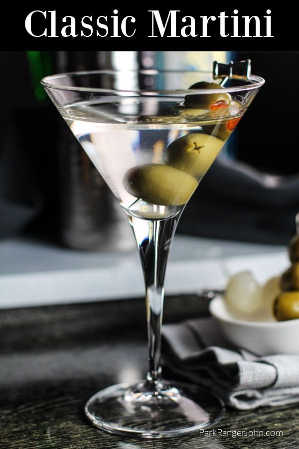 a martini glass with olives in it