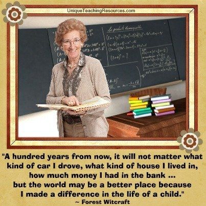 an older woman holding a book in front of a chalkboard