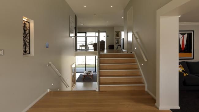 a staircase leading up to a living room