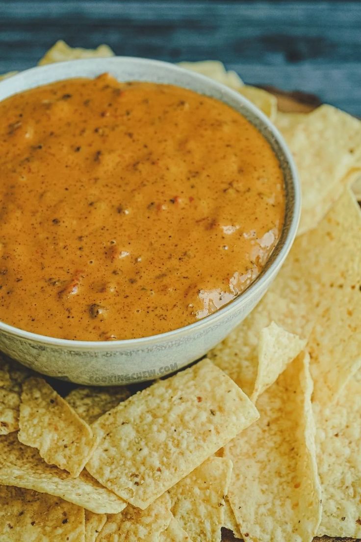 tortilla chips and salsa in a bowl on a plate