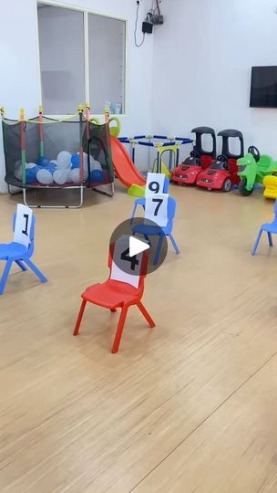 children's playroom with chairs and toys on the floor in front of them