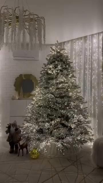 a white christmas tree in a living room