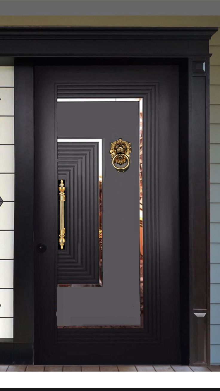 a black front door with a gold handle