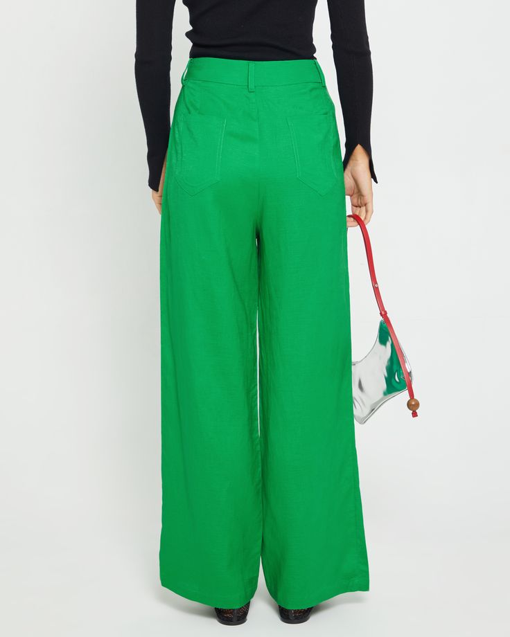 Product Details The Freda Pant's bright green hue is fun and fresh, while its high-waisted design and straight leg create a modern silhouette. Add this piece to your look for an instantly stylish upgrade. - Front button and zipper- Front pocket- Back pocket- Content: 30% Linen, 70% Rayon Style# C23WPA00225 Fit Notes - Model wearing a size XS - Model measurements: 5'8' Height / 32'' Bust / 23.5'' Waist / 34'' Hips- Garment measurements: Size Length Waist Hips XS 104.78 68.58 93.98 S 105.73 72.39 Casual Green Wide Leg Pants For Spring, Green Wide Leg Pants For Work, Casual Green High Waist Wide Leg Pants, Green Casual High-waisted Pants, Casual Green High-waisted Pants, Casual High-waisted Green Pants, Green Wide-leg Pants For Spring, Green High-waisted Pants With Pockets, Green High-waisted Wide Leg Pants With Pockets