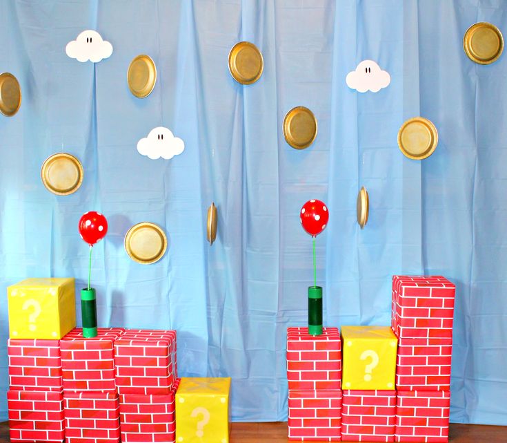 a nintendo themed birthday party with gold coins and mario's castle blocks on the floor