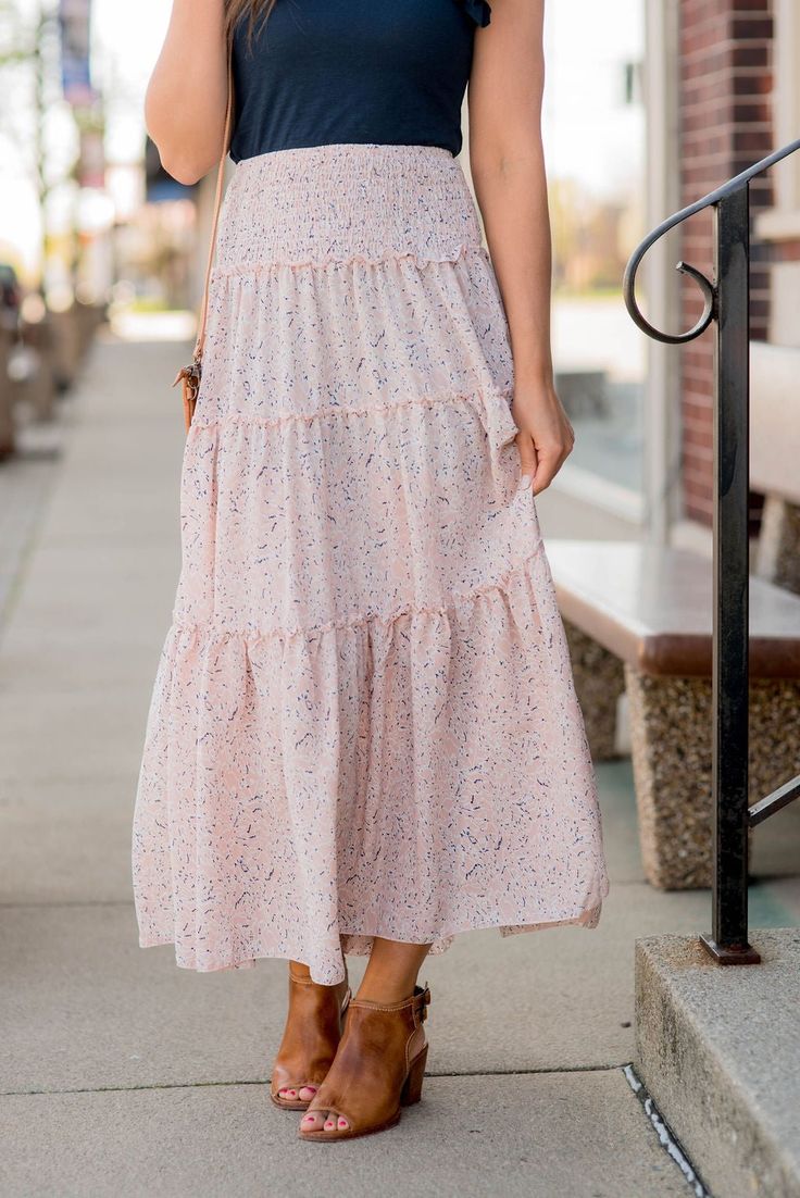 We cannot get over how stylish this skirt is! The fun print and tiered style fit makes such a cute, elegant look! Wear this skirt to any event and you are sure to receive compliments! We love tucking a blouse into this for a more elevated look or a basic or graphic tee for a casual feel! Chic Tiered Maxi Skirt For Summer, Casual Tiered Pleated Maxi Skirt, Tiered Maxi Skirt For Summer Day Out, Casual Tiered Maxi Skirt For Brunch, Relaxed Tiered Skirt For Spring, Chic Tiered Voluminous Skirt, Spring Tiered Voluminous Skirt, Chic Voluminous Tiered Skirt, Summer Tiered Lined Maxi Skirt