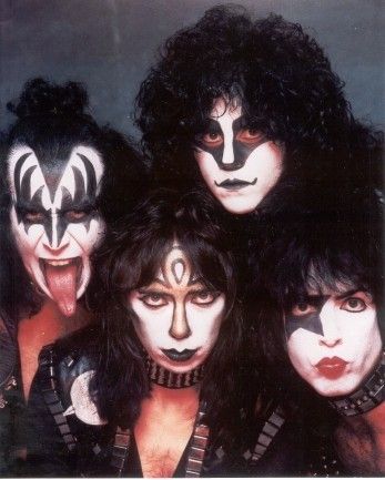 kiss band members with their faces painted black and white